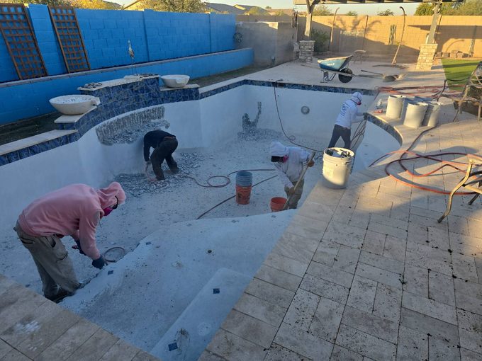 Pool remodel in progress with old plaster removed in Tempe, AZ