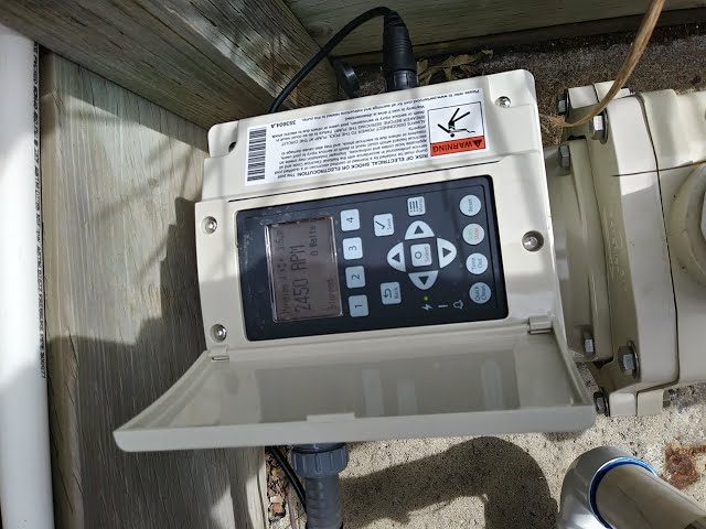 Variable-speed pool pump control panel set to a low, energy-saving RPM